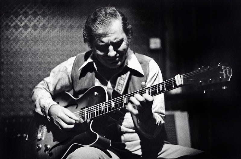 Chuck Wayne demonstrating picking technique on a jazz guitar